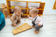 Toddlers playing xylophone