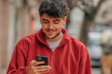 Canvas Print - boy with mobile phone in the street