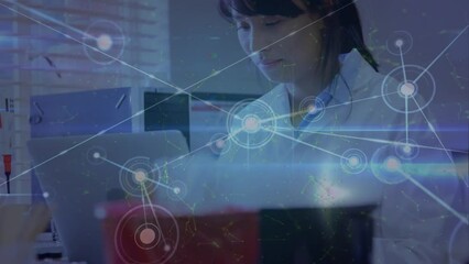 Poster - A laboratory technician is paying attention to a laptop in a blood bank