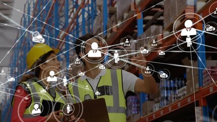 Poster - Animation of icons connected with lines over caucasian coworkers discussing in warehouse