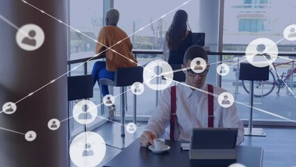 Poster - Animation of network of profile icons over caucasian man using digital tablet at office