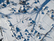 Aerial view of snow covered roofs over the traditional chalets in the village of  alps.
