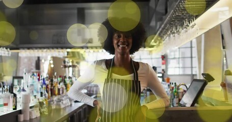 Poster - Animation of spots over african american female worker in shop