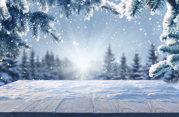 Wall Mural - merry christmas and happy new year greeting background with table .winter landscape with fir tree br