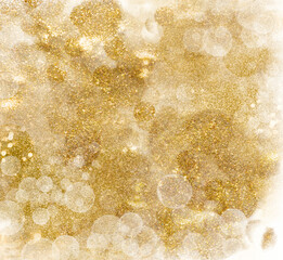 Wall Mural - golden glittering pattern. festive background of shiny shimmering sparkles