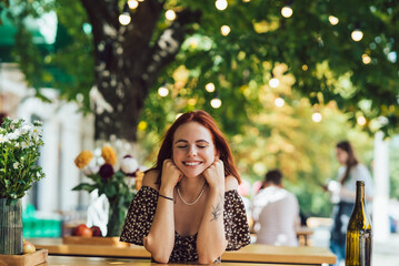 Close-up portrait of two female at summer street cafe