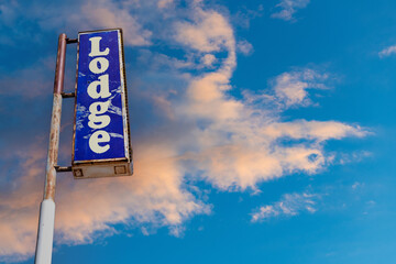 Weathered vintage sign of an abandoned motel with the text of 