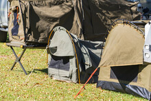 Several Sleeping Swags Set Up On A Grassy Area Of A Campground