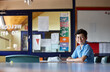 © Austockphoto - Primary school student in classroom working on homework