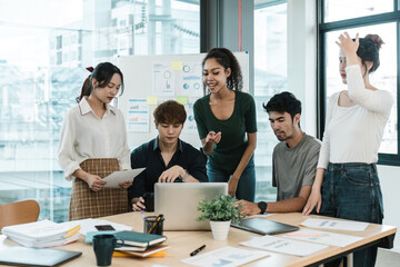 Wall Mural - Young asian people having business meeting in office. teamwork brainstorming planning meeting concept