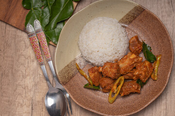 Wall Mural - Stir-fried pork ribs with curry paste and steamed rice