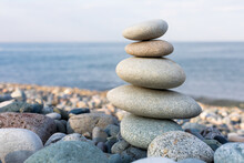 Stack Of Zen Stones In Harmony And Balance With Sea View