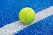 selective focus, one ball on the line of a blue paddle tennis ball