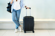 © PBXStudio - Asian woman teenager using smartphone at airport terminal standing with luggage suitcase and backpack for travel in vacation summer