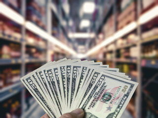 Wall Mural - supermarket with blurred background and fifty dollars for shopping price