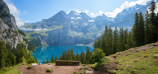 Wall Mural - viewpoint lake Oeschinensee with wooden bench. pictorial alpine landscape kandersteg switzerland