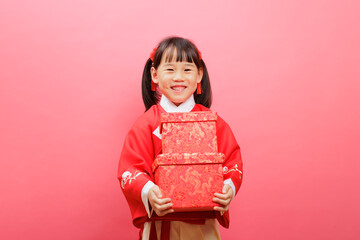 Wall Mural - Happy Chinese New Year, young girl holding gift box against pink plain background