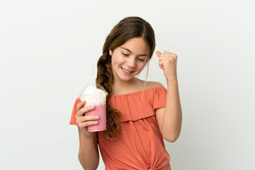 Sticker - Little caucasian girl with strawberry milkshake isolated on white background celebrating a victory