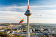 Giant tricolor Lithuanian flag waving on Vilnius television tower on the celebration of Restoration of the State Day.