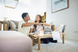 © DifferR - Asian couple in home or house. Include increasing graph, laptop, calculator and document on table. To bump punch with concept for market price, house value, loan, finance, real estate and property.
