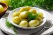 Young boiled potatoes with dill, parsley and onions