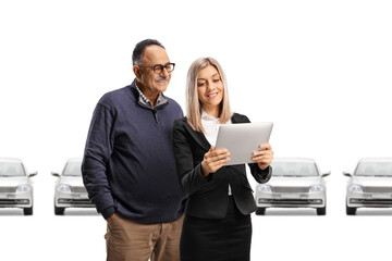 Sticker - Businesswoman presenting cars to a mature customer on a digital tablet