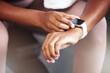 © Mia B/peopleimages.com - Smartwatch, check or hands with time for fitness progress, heart rate or gps for running training exercise. Sports, athlete or black woman reading timer on smart watch ai or workout performance stats