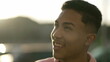 © Marco - One ecstatic young hispanic man turning head to sky smiling with Hope and faith. Charismatic latin person laughing and feeling joy