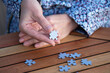 © Rudaieva Iryna - Woman is holding puzzle pieces in her hands. Business decisions, success and strategy concept