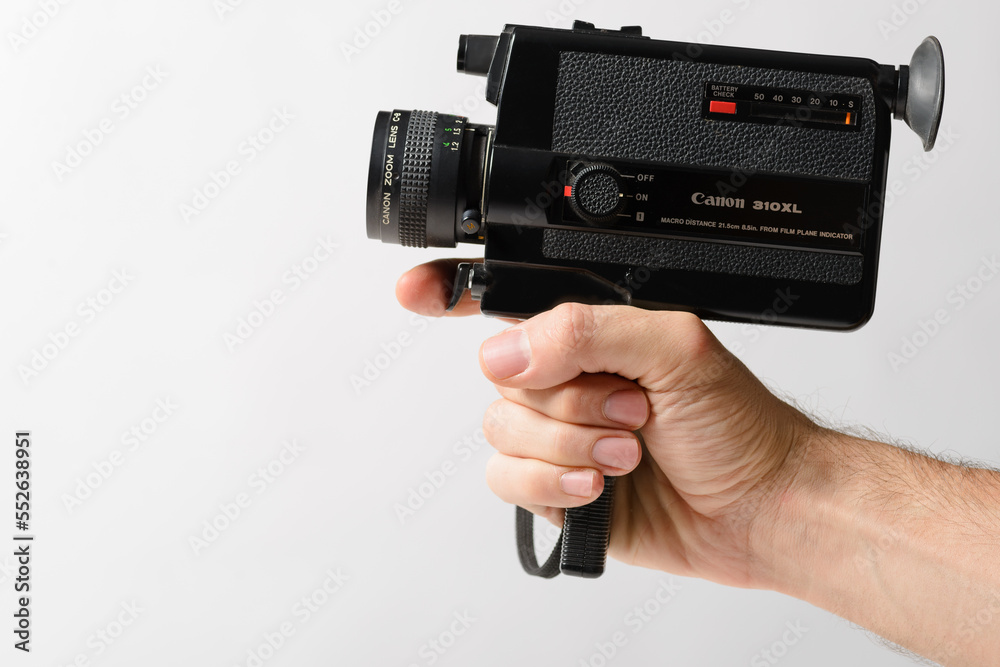 Hand holding a Canon 310xl Super 8mm amateur old fashion camera on