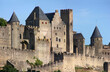 The Count’s Castle in the old town of Carcassonne with romanesque towers and the medieval city wall, Aude department in France