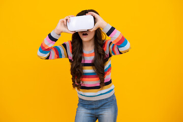 Teen girl hold vr glasses using future technology for education, vr school. Funny teenager playing 3d games in augmented reality. Shocked amazed face, surprised emotions of young teenager girl.