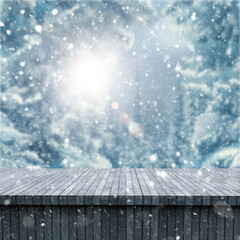 Poster - 3D Christmas background with wooden table against a wintry landscape