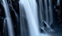 Close-up Of A Series Of Waterfalls, The Soft Blur Of Flowing Water Over Black Rock; Iceland