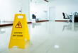 Wet floor caution sign in office