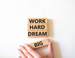 © Natallia - Work and dream symbol. Wooden blocks with words Work Hard Dream Big. Beautiful white background. Businessman hand. Business and Work Hard Dream Big concept. Copy space.
