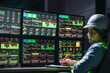 © leonidkos - Head engineer following the factory process using Industry 4.0. Facility operator control production uses computer screens with SCADA system