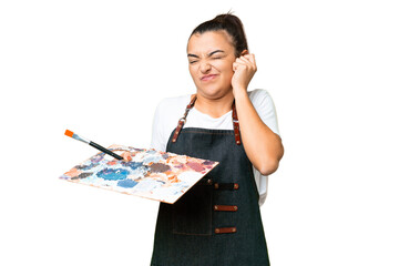 Poster - Young artist woman holding a palette over isolated chroma key background frustrated and covering ears