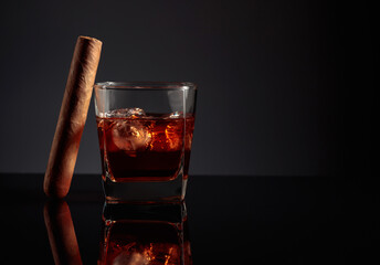 Poster - Glass of whiskey with ice and cigar.