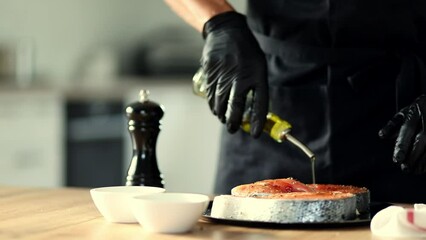 Sticker - Salmon cooking video. Chef cooking raw salmon fish steaks