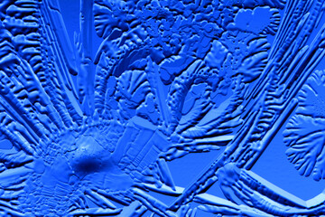 Canvas Print - Drawings of ice on blue glass.