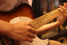 Close Up Asia Youth Playing Beautiful Telecaster Guitar