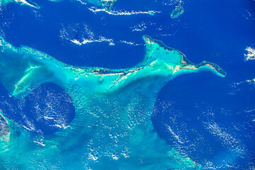 Wall Mural - Turquoise and blue waters in the Caribbean. Digital enhancement. Elements by NASA