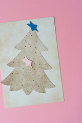 Wall Mural - two stars, tree, and blank paper on pink