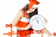 © yurolaitsalbert - beautiful young woman in Christmas suit with a clock sitting on the boxes with Christmas gifts.