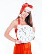 © yurolaitsalbert - closeup.beautiful young woman in Christmas costume with the large clock.isolated on white