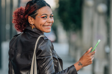 Canvas Print - urban girl with mobile phone in the street