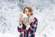 © be free - just try it. girl make and play snowball. winter activity. happy woman enjoy winter landscape. woman warm clothes in snowy forest. trees covered white snow. female casual style for cold season