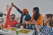 © gstockstudio - Happy young people playing board game while enjoying carefree time together