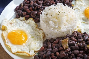 Beans with rice and egg. Typical food from the Caribbean, many parts of Latin America and Sephardic communities.